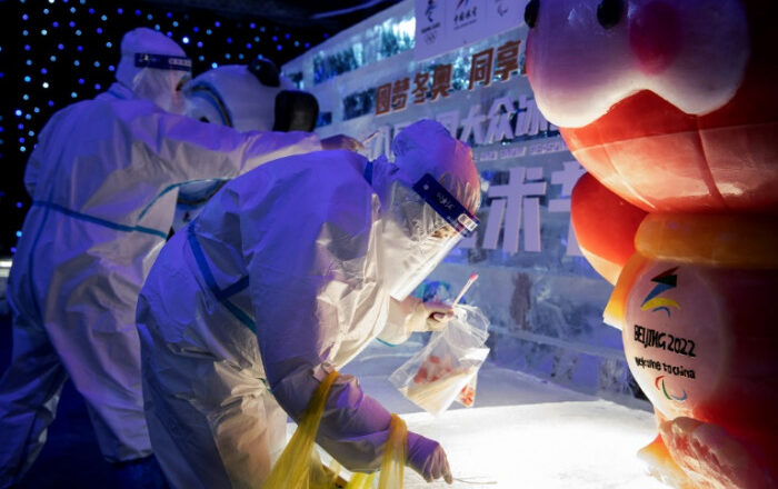 China locks down city as Covid cases surge around the world